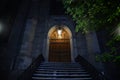 Wooden door by a staircase in the dark Royalty Free Stock Photo