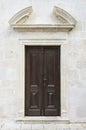 Wooden door on stone wall church Royalty Free Stock Photo