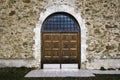 Wooden door on stone wall church Royalty Free Stock Photo