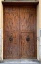 Wooden door in stone wall in Mallorca, Spain Royalty Free Stock Photo