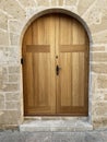 Wooden door in stone wall in Mallorca, Spain Royalty Free Stock Photo