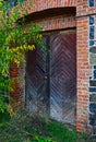 Wooden door to an abandoned old building Royalty Free Stock Photo