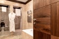 Wooden door to the bathroom in hotel or apartament. Royalty Free Stock Photo