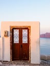 Wooden Door to nowhere. Santorini island view. Cyclades, Greece Royalty Free Stock Photo