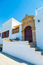 Wooden door in traditional Greek house in the historic village of Lindos on Rhodes island. Greece. Europe Royalty Free Stock Photo