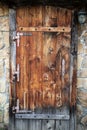 Wooden door in a wall of masonry Royalty Free Stock Photo