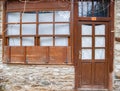 Wooden door and window on facade of old country house Royalty Free Stock Photo