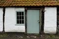 Wooden door and window with squares of Traditional barn in North of province Antwerp, Belgium