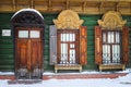 Wooden door and windows with carved accents