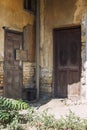 Wooden doors in an abandoned old house. Vertical Royalty Free Stock Photo