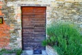 Wooden doors on the stone wall