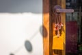 Wooden doors with glass hanging, Japanese wooden signs in front of the cafe.