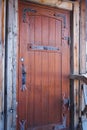 Wooden doors with metal forged inserts Royalty Free Stock Photo