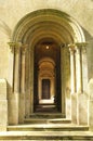 Wooden Door way through stone arches