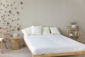 Wooden double bed with comfortable orthopedic mattress, white sheet