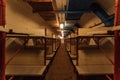 Wooden double-decker beds inside old abandoned soviet bomb shelter