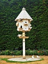 Wooden dovecote with white doves