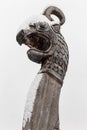 wooden dragon head on Drakkar against a gray sky