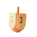 Wooden dreidel (spinning top) for hanukkah jewish holiday isolated on white.