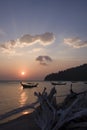 Wooden dry stump on foregorund and long tail boats, Thailand Royalty Free Stock Photo