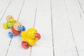 Duck pull toy with a string on a white wooden background Royalty Free Stock Photo