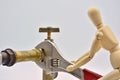 Wooden mannequin with an adjustable wrench Royalty Free Stock Photo