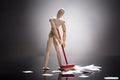 Wooden Dummy Figure Cleaning Floor Royalty Free Stock Photo