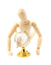 Wooden dummy and glass earth globe Royalty Free Stock Photo