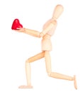 Wooden Dummy holding red heart Royalty Free Stock Photo