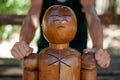 wooden dummy for martial arts, person practicing punches