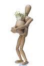 Wooden dummy and pot with cuckooflower Royalty Free Stock Photo
