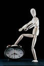 wooden dummy and analogic clock, time concept, puppet made of wood, art mennequin.Wooden Doll