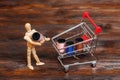 Wooden dummy puppet and mini shopping cart with thread spools