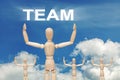Wooden dummy puppet on sky background with word TEAM Royalty Free Stock Photo