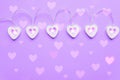 Wooden eart-shaped harland on purple background. Greeting card for st valentine`s day, Copy space