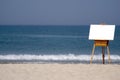 Wooden Easel and Blank Canvas on Beach Royalty Free Stock Photo