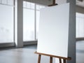 Wooden easel with a blank white canvas in modern interior. Royalty Free Stock Photo