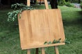 Wooden easel with a board. On the board written white paint - We Royalty Free Stock Photo