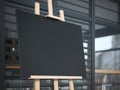 Wooden easel with a canvas on the street near cafe. Royalty Free Stock Photo