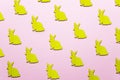Wooden Easter Bunnies as attribute of Easter celebration. Pink background