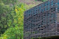 Wooden eco texture on the facade of a modern building. Background with selective focus Royalty Free Stock Photo