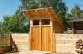 Wooden ecological toilet in the village. general sanitary unit Royalty Free Stock Photo