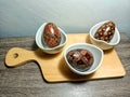 wooden egg display on a table with an Indonesian batik motif. Placed on a wooden table