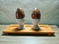 wooden egg display on a table with Indonesian batik motif. Placed on a wooden table.