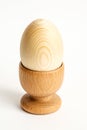 Wooden egg in the holder Royalty Free Stock Photo