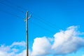 Wooden electric pole under a blue sky. Royalty Free Stock Photo