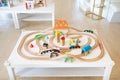 A wooden electric train and railway toy set for children in a daycare place and indoor playground Royalty Free Stock Photo