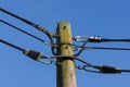 Wooden electricity post against blue sky Royalty Free Stock Photo