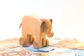 Wooden elephant with money