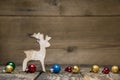 Wooden elk or reindeer on rustic country style background